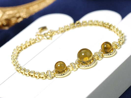 Opulent Gold-Tone Bezel-Set Blue Amber Tennis Bracelet